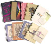 an assortment of custom journals with clear poly covers